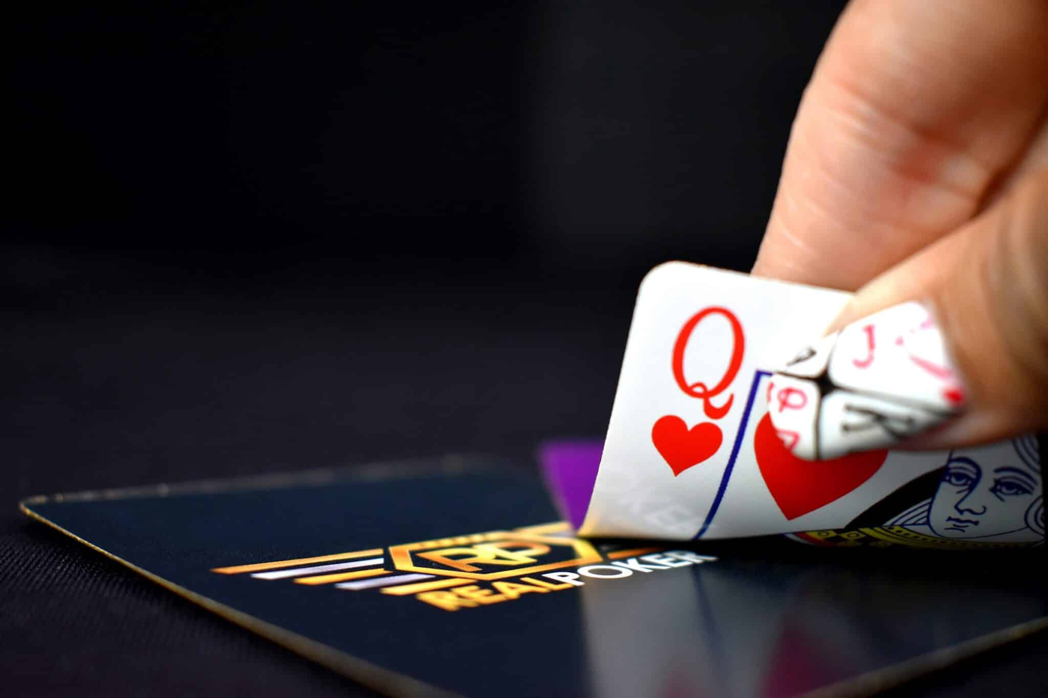 selective focus photography of queen of hearts playing card